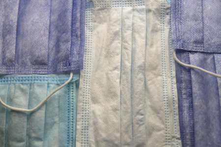 Background layering of disposable surgical face mask for virus protection