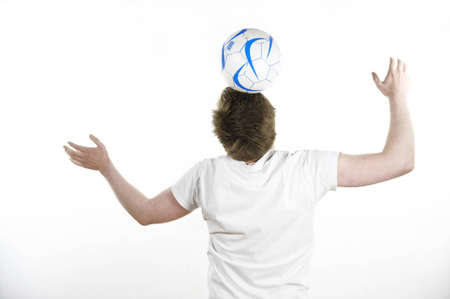 Young man with a ballの写真素材