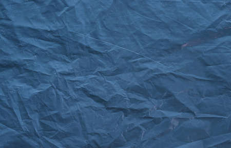 Dark blue toned textured background.の写真素材