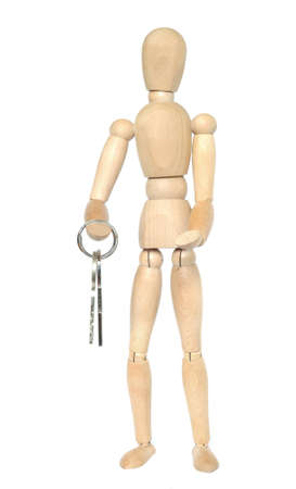 Wooden dummy with keys. Isolated on white.の写真素材