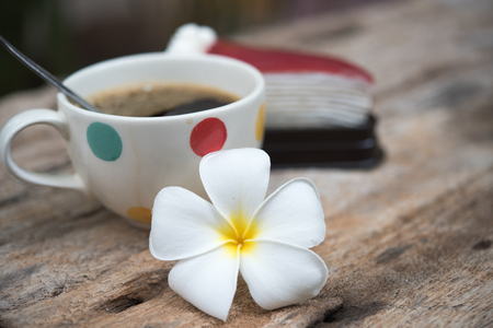 Leelavadee (Plumeria) tropical flower have white cup coffee backgroundの写真素材