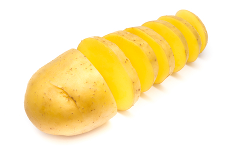 New potato cut isolated on white background close upの写真素材