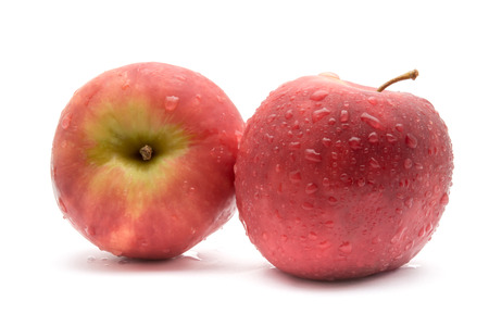 Red apple on white background with water drop in Full Depth of Field with Clipping Path.の写真素材