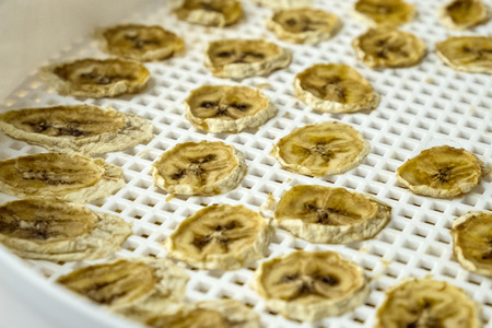 baking and drying of bananas in a drying plantの写真素材