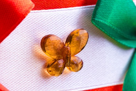 element of decoration packing gift box close-up, decoration of transparent glass in the form of a butterflyの写真素材