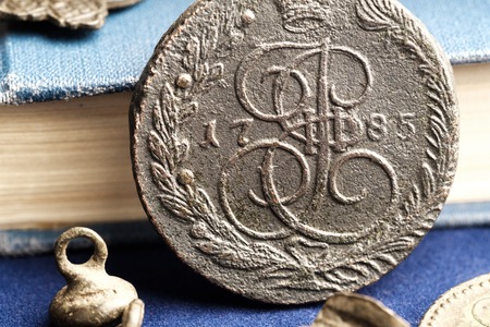 5 kopecks of the Russian Empire in 1785 against the backdrop of the old bookの写真素材