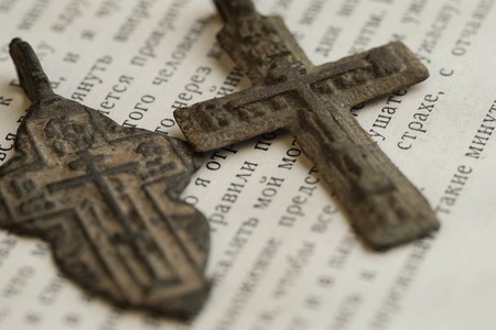 religious orthodox symbols in the form of a cross on an open bookの写真素材