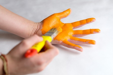 coloring orange hands palm, children's creativity aの写真素材