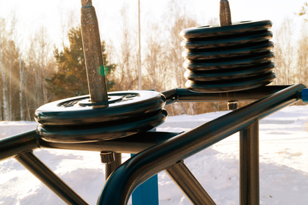 disks at the simulator standing on the street in the winter time, playing sportsの写真素材