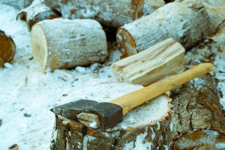 wooden chocks for firewood that need to split the cleaver on a stumpの写真素材