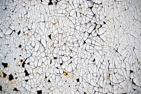 background of an old cracked paint on an iron surface, a paint of white color a textureの写真素材