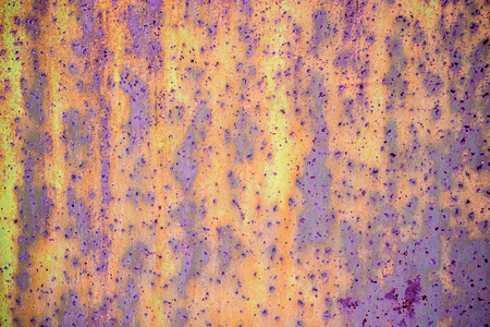 green rusty background on a metal surface old paint peeled