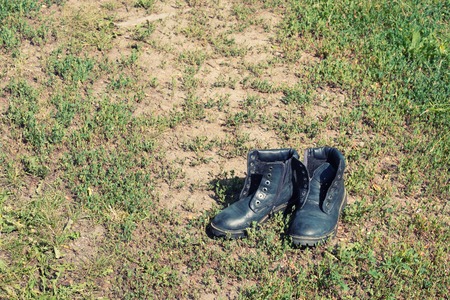 thrown on the road shoes, shoes worn out with the long walk I had to go barefootの写真素材