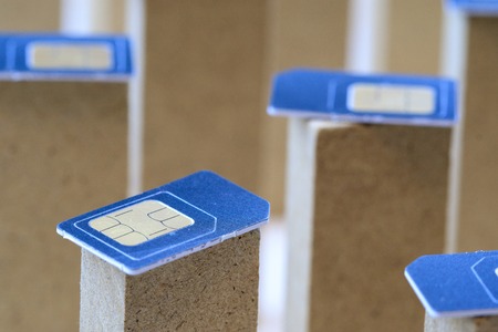 hills in the form of rectangular wooden bars on them put SIM cards for phones, side viewの写真素材
