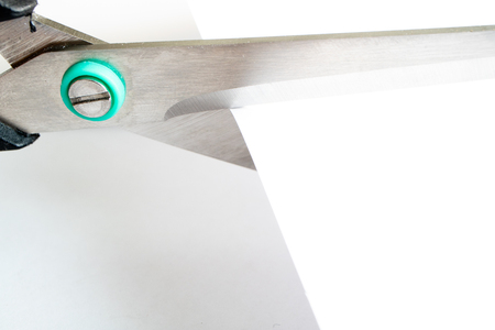 close-up scissors cuts white paper