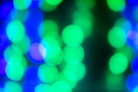 green and blue spots are from the lights out of focus bokeh natural lights from Windows on the streetの写真素材