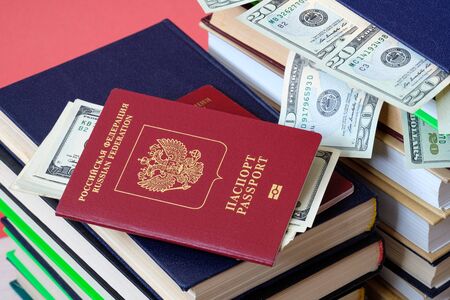 the passport is a book of passport and stick out from the book of money dollarsの写真素材