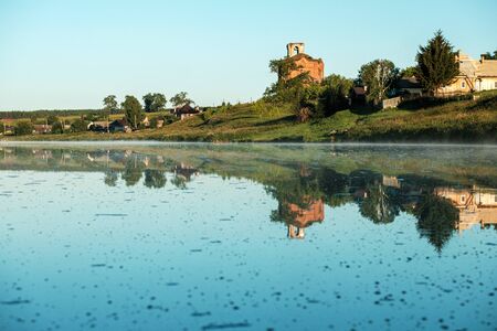 village landscape river a on the Bank of the old Church of the 18th century and housesの写真素材