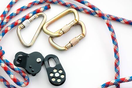 equipment with carabiners and rope on a white surface for work at heightの写真素材