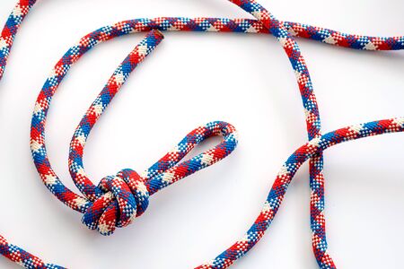 loop on a twisted rope on a white surface. multi-colored rope for climbing workの写真素材