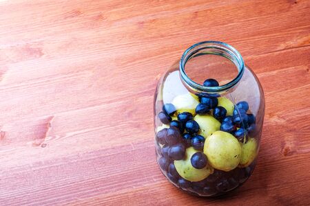 fruit inside a glass jar on the table. for preserving fruit for the winter at homeの写真素材