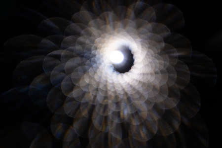 abstract tunnel of many glowing highlights out of focus. movement towards light after deathの写真素材