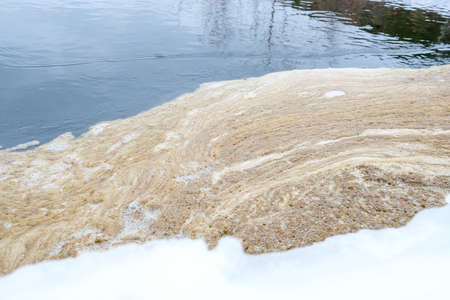 foam on a body of water is a sign of water pollution. ecology problemの写真素材