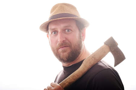 surprised face of a man with a beard who wears a hat on his head. the woodcutter is surprised at...