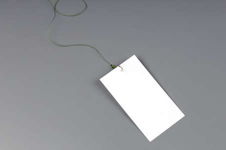 a blank white card attached to a fish hook. blank paper for addiction concept