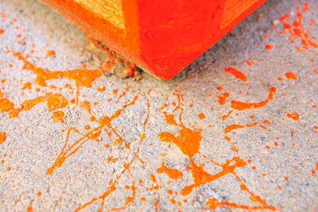 paint marks on the asphalt in the process of painting the trash can on the street. painter's untidinessの写真素材