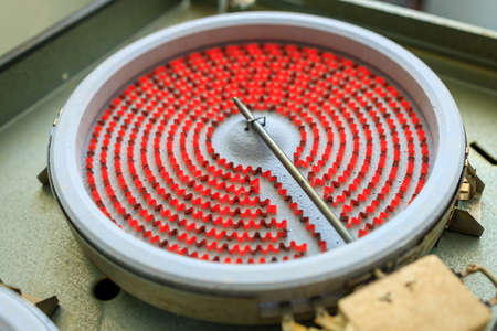 electric kitchen stove under repair with an open heating element preheated red-hot. very high...
