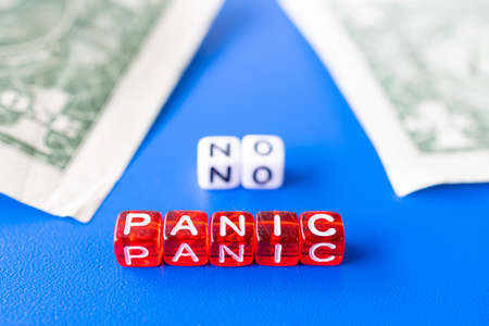 the assembled word no panic on the background of money. no need to panic everything is calm with financesの写真素材