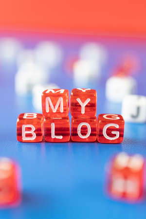 vertical photo with cubes on which my blog is written. cover concept for website or blog