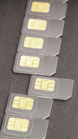 vertical photo from a number of SIM cards for smartphones in grayの写真素材