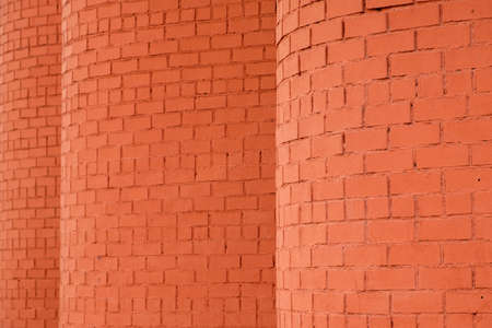 texture of a brick wall of a semicircular shape. unusual walls