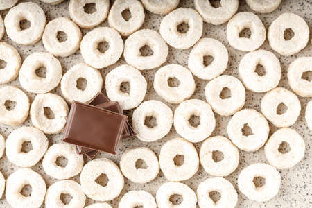 chocolate wedges on a corn breakfast in the form of rings, top view