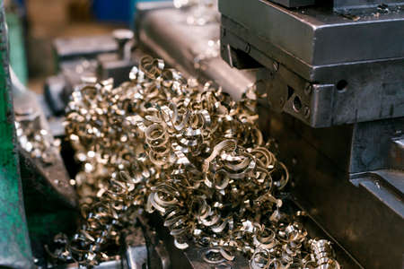a large amount of metal shavings near the drilling machine. metal processing