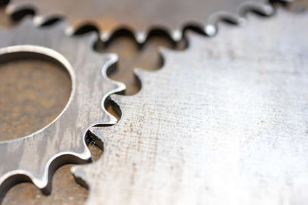 close-up of metal gears with cogs, scuffed metal textureの写真素材