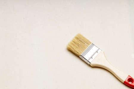 a new unused brush on a blank canvas canvas. blank canvas and brushの写真素材