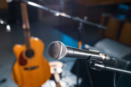 stage with a microphone and musical instruments before the performance. waiting for the musiciansの写真素材