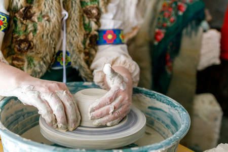 close-up of the hands of a potter who works with clay, a passion for manual work to calm the nervesの写真素材
