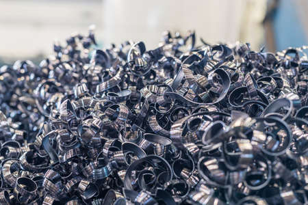a pile of metal shavings. spirals and zigzags made of metal. production waste