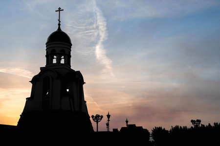 Orthodox chapel against the backdrop of a beautiful sky during sunset. faith and beauty of heavenの写真素材