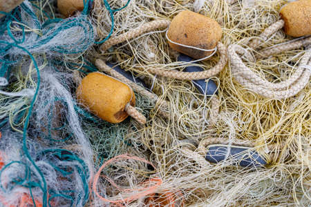old tangled fishing net, illegal poaching method of fishing. pollution of the sea and water bodiesの写真素材
