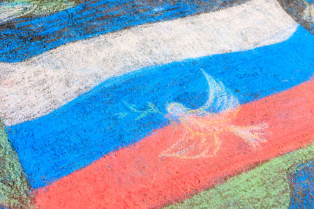 the Russian flag is drawn by a child on the pavement, a temporary drawing. Russian flag colorsの写真素材