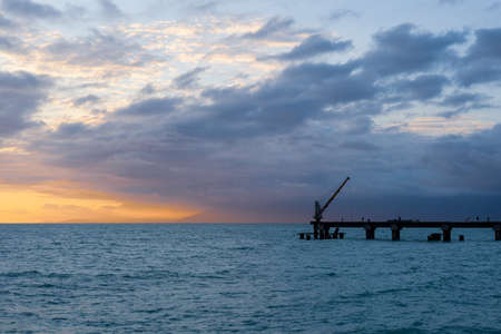 sunset on the sea, skyline and old sea pier. sea in the evening seascape