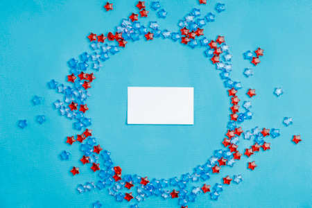 a white business card with plastic stars around it. circle near significant objectの写真素材