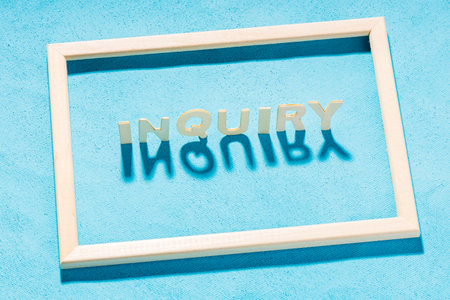 inside a wooden frame on a blue background an inscription from wooden letters - request. boxed query...