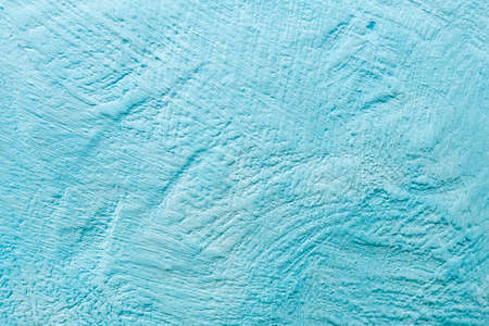 blue surface texture of uneven plaster. the surface of the plaster on the wall is unevenly applied