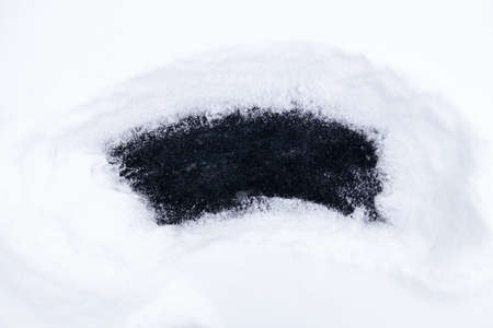 a place on ice cleared of snow, black ice free space. cleared placeの写真素材